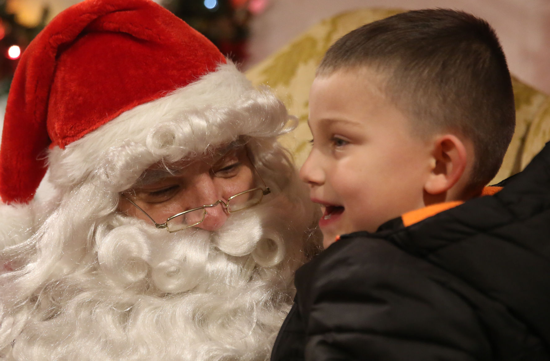 Santa and Mrs. Claus try out their new house in Lansing